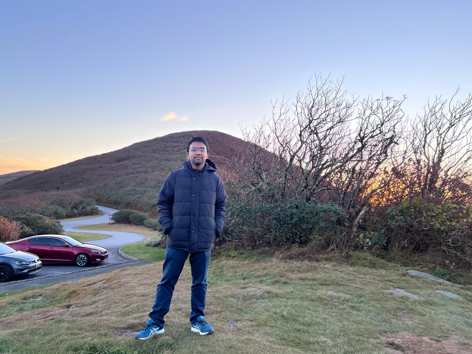 Standing on a hilltop at sunset